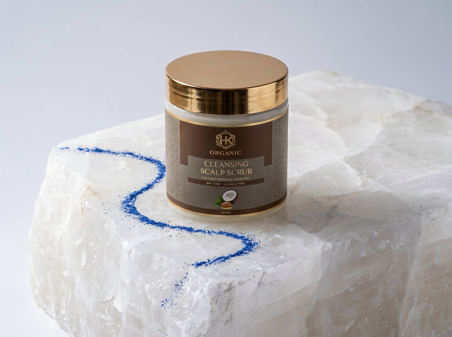 Jar of cleansing scalp scrub on a textured white surface with a blue line